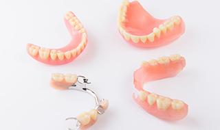 Various types of dentures on a table